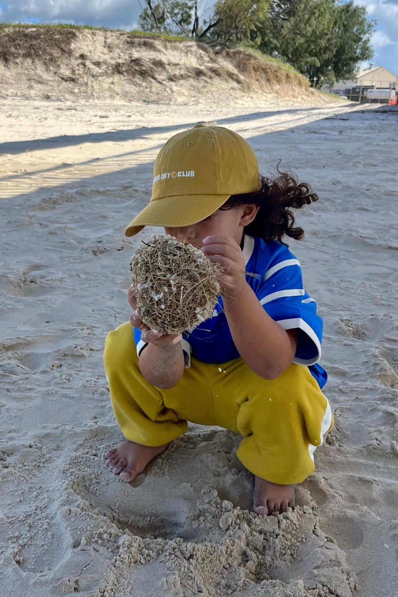 The Little Stacked Retro Sweatpants in mustard and butter feature a retro stripe design