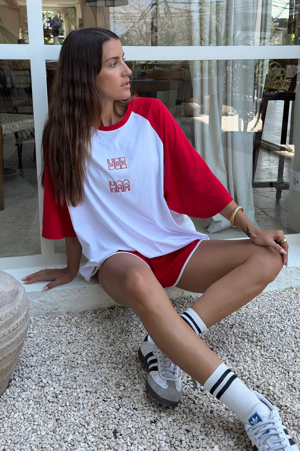 women wearing red and white raglan sleeve tee shirt
