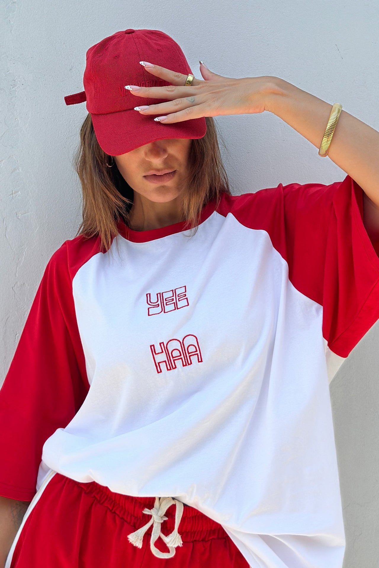 women wearing red and white raglan sleeve tee shirt